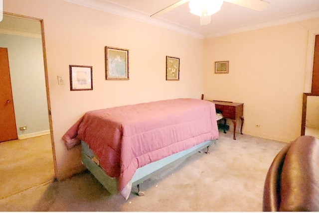 bedroom with ceiling fan, carpet flooring, and ornamental molding