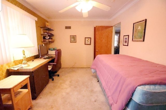 bedroom featuring light colored carpet, crown molding, and a ceiling fan