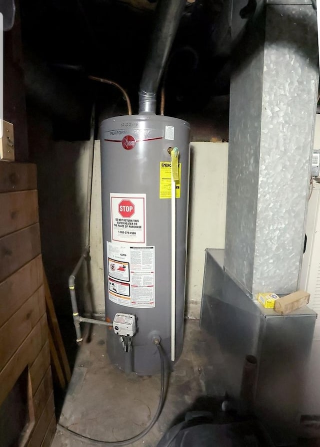 utility room with water heater