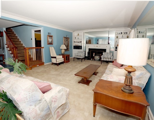 carpeted living room featuring stairway, a fireplace, baseboards, and ornamental molding