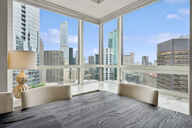 unfurnished sunroom featuring a view of city and plenty of natural light