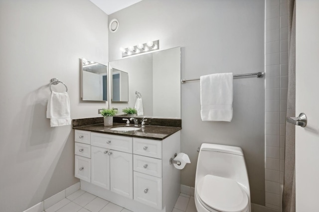 full bath featuring baseboards, vanity, toilet, and tile patterned floors