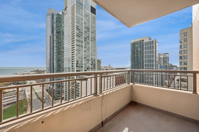 balcony with a view of city and a water view