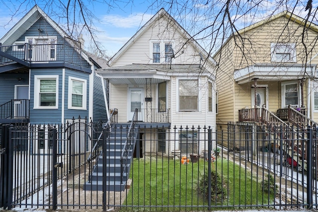 3323 N Central Park Ave, Chicago, IL 60618 - shotgun-style home with a fenced front yard and covered porch
