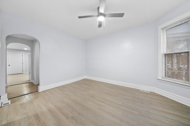 3323 N Central Park Ave, Chicago, IL 60618 - unfurnished room with ceiling fan, baseboards, visible vents, and light wood-style floors