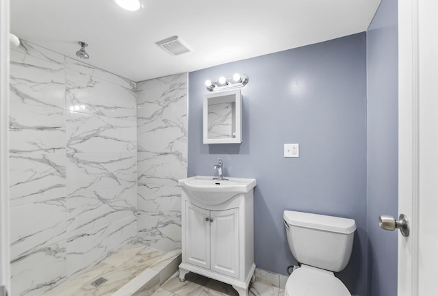 bathroom with a marble finish shower, visible vents, toilet, marble finish floor, and vanity