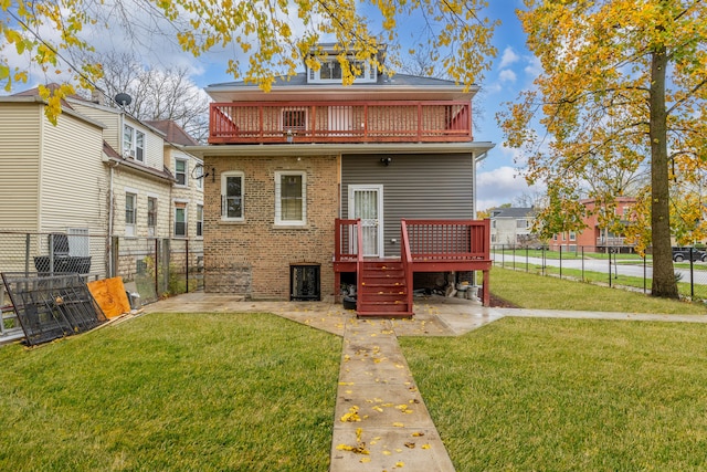 back of property with a yard, a fenced backyard, a patio, and a wooden deck