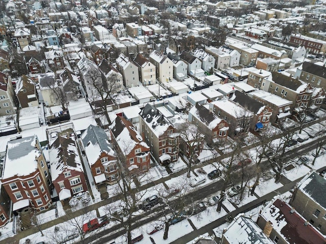 snowy aerial view featuring a residential view