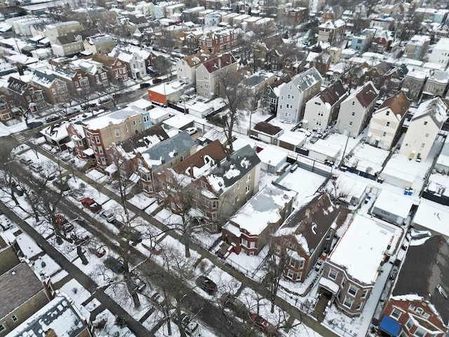 snowy aerial view featuring a residential view