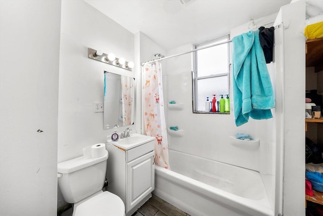 full bathroom featuring toilet, shower / bath combination with curtain, and vanity