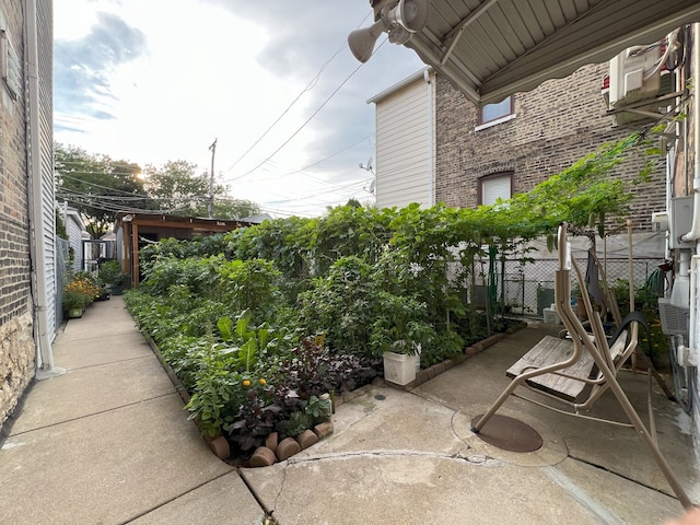 view of patio featuring fence