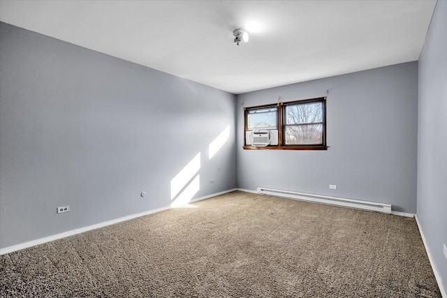 carpeted spare room featuring a baseboard radiator, cooling unit, and baseboards