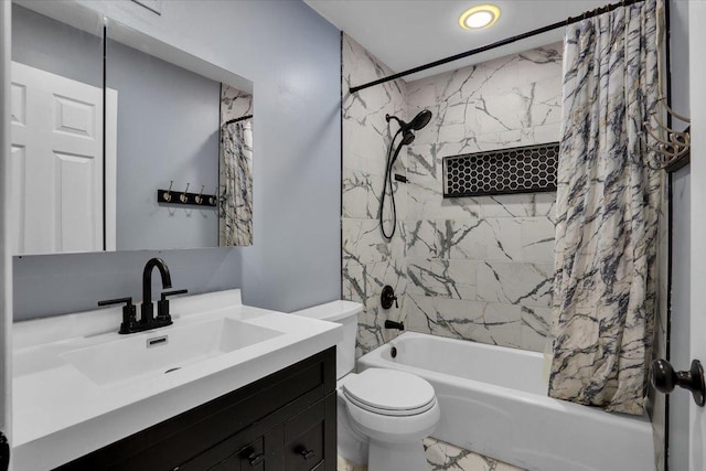 bathroom with toilet, vanity, and shower / tub combo with curtain