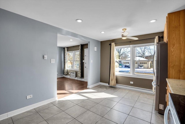 interior space with recessed lighting, baseboards, and light tile patterned floors