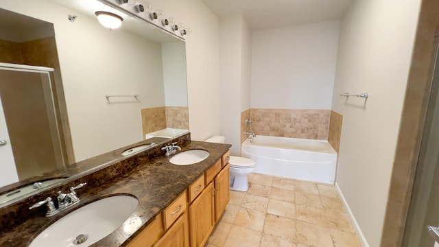 bathroom featuring a stall shower, a garden tub, and a sink