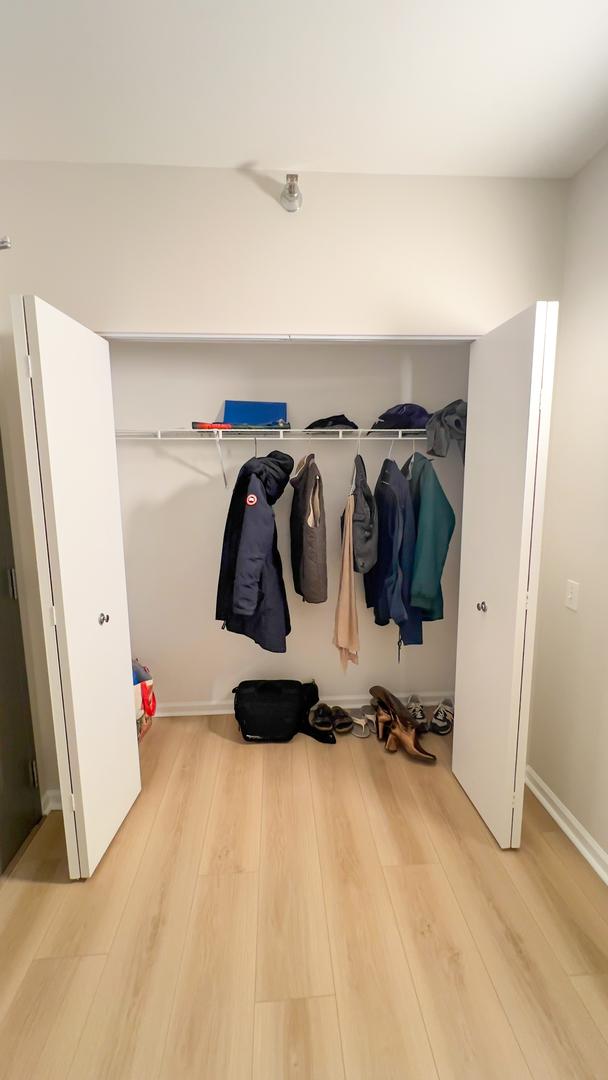 mudroom with baseboards and wood finished floors