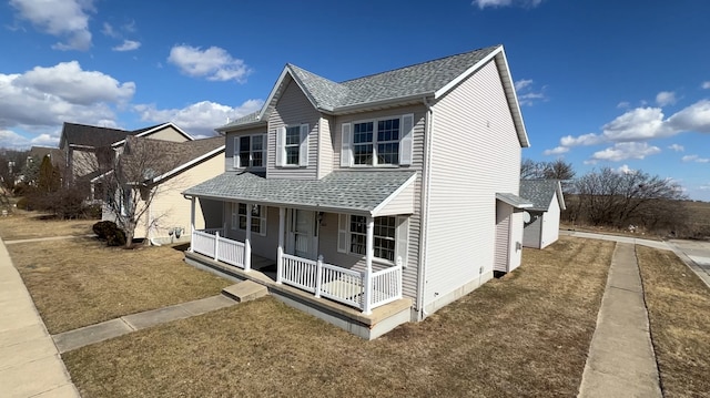 view of side of home featuring a porch and a shingled roof