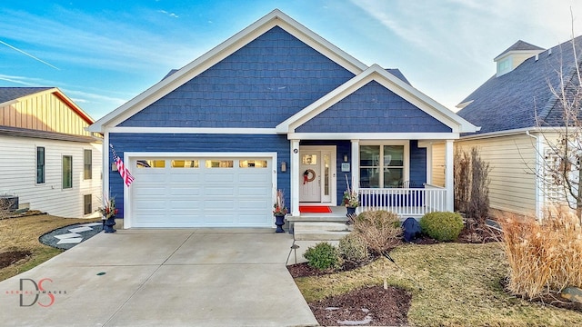 view of front facade featuring a garage, covered porch, driveway, and central AC unit