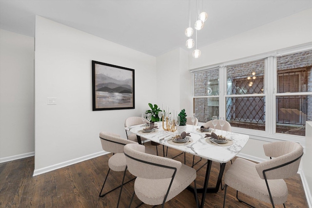 dining room with wood finished floors and baseboards