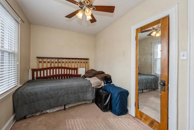 bedroom with carpet floors, baseboards, and a ceiling fan