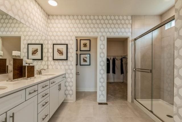 382 W Point Cir, Algonquin, IL 60102 - bathroom featuring wallpapered walls, a shower stall, baseboards, and a sink