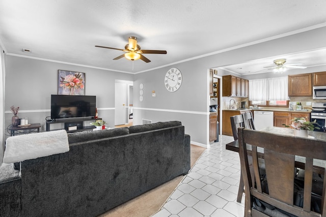 living area featuring ornamental molding and a ceiling fan