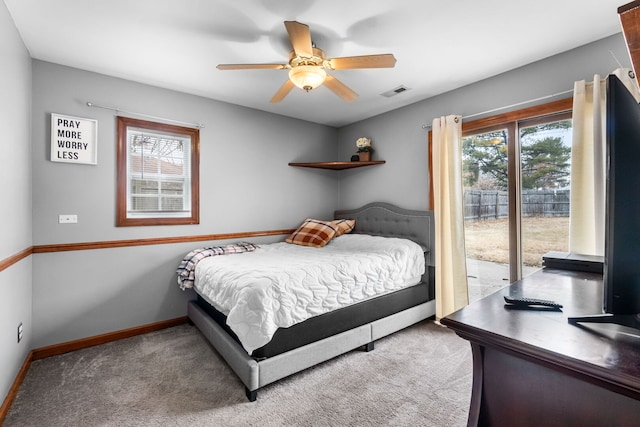 bedroom with carpet floors, access to exterior, baseboards, and visible vents