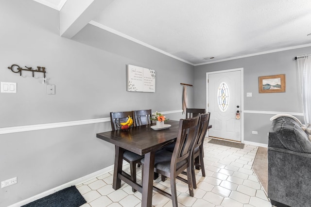 dining space with visible vents, crown molding, and baseboards