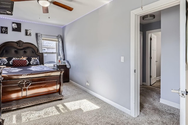 carpeted bedroom featuring ceiling fan and baseboards