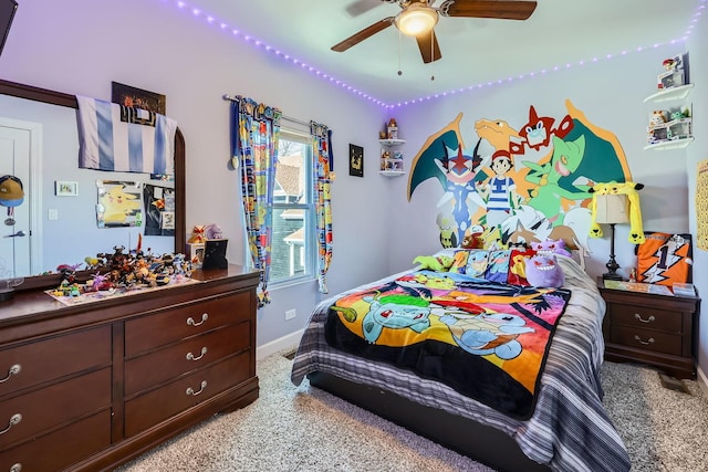 bedroom with baseboards, a ceiling fan, and light colored carpet