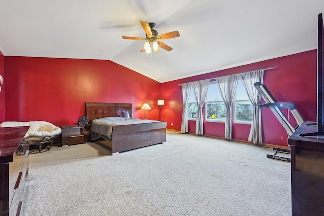 carpeted bedroom with lofted ceiling, ceiling fan, and baseboards