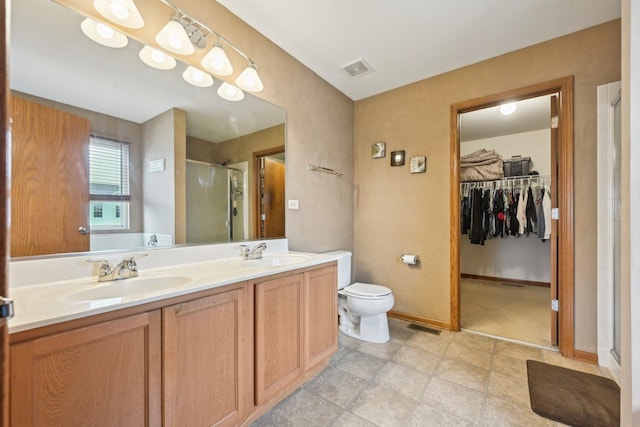 full bath with a shower stall, visible vents, and a sink