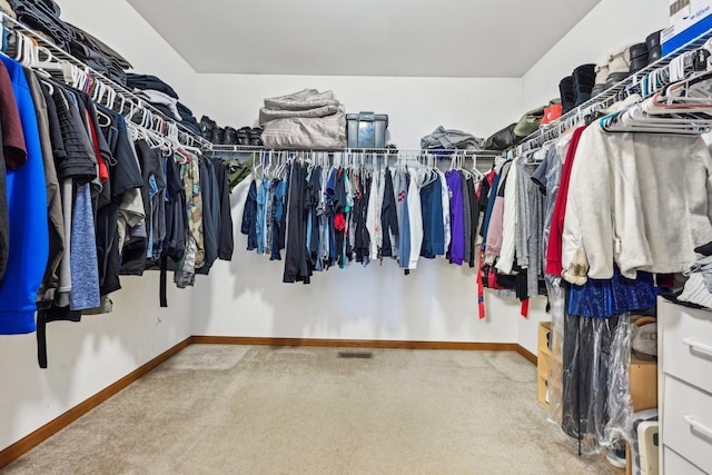 spacious closet with carpet and visible vents