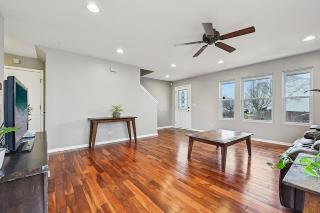 living area with recessed lighting, baseboards, and hardwood / wood-style flooring