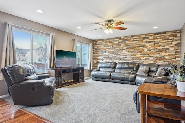 living area with a fireplace, recessed lighting, ceiling fan, wood finished floors, and baseboards