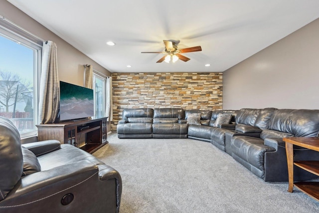 carpeted living area featuring ceiling fan, a wealth of natural light, and recessed lighting