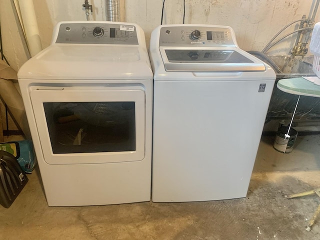 laundry area featuring washing machine and dryer and laundry area