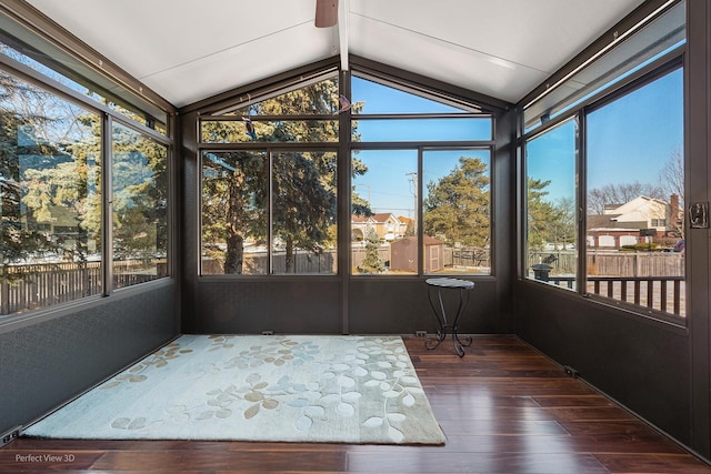 unfurnished sunroom with a healthy amount of sunlight and vaulted ceiling