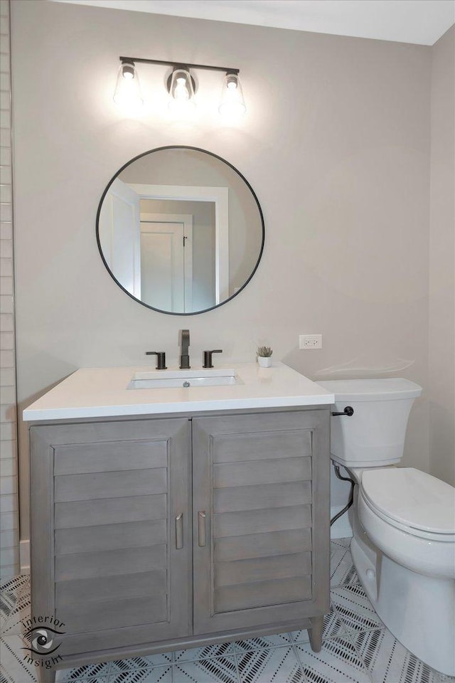 bathroom with vanity and toilet