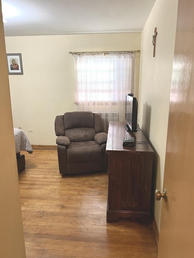 living room with light wood-style floors and baseboards