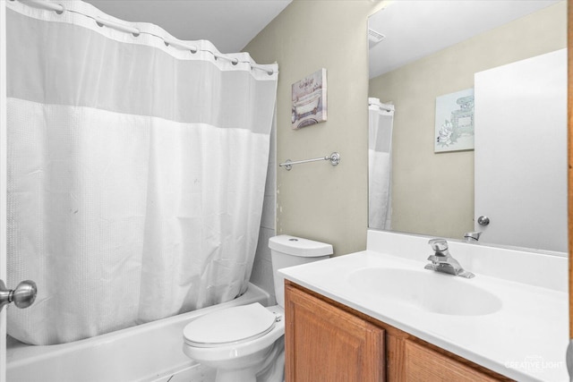 full bath featuring shower / bath combination with curtain, vanity, and toilet