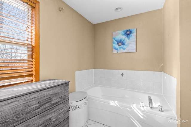 full bath with a bath and tile patterned floors