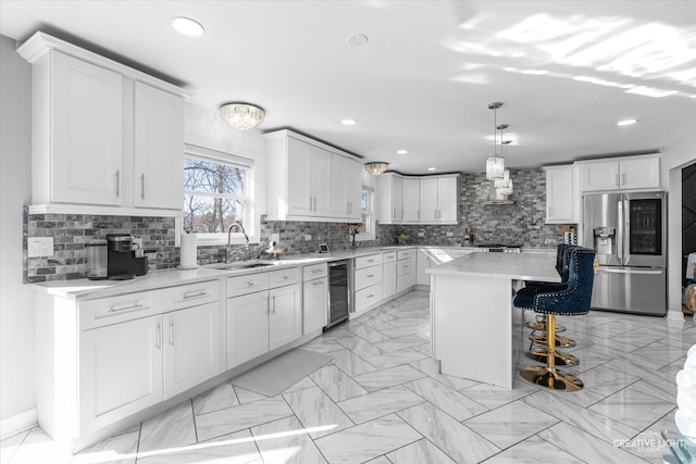 kitchen featuring smart refrigerator, a kitchen island, and white cabinets