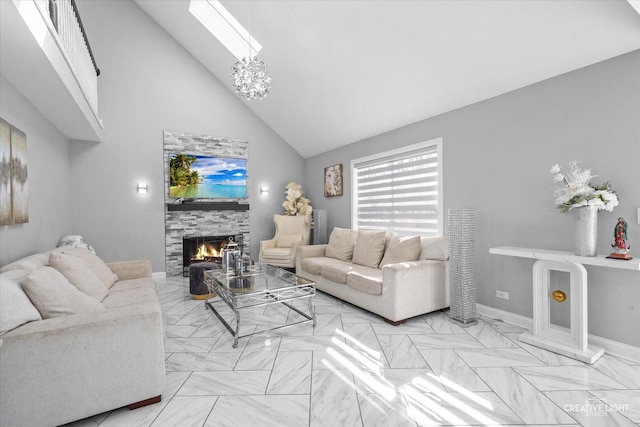 living area featuring high vaulted ceiling, baseboards, a chandelier, and a tile fireplace