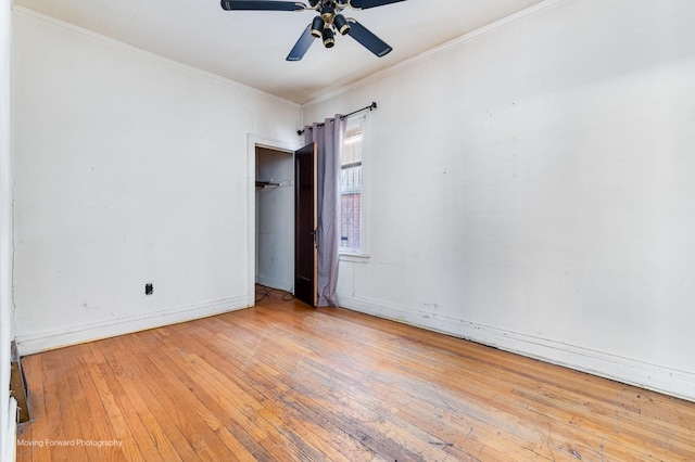 unfurnished room featuring ornamental molding, baseboards, ceiling fan, and light wood finished floors