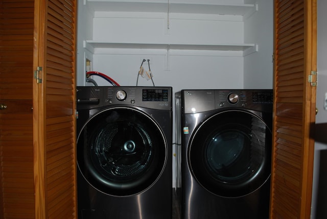 laundry area featuring laundry area and washer and clothes dryer