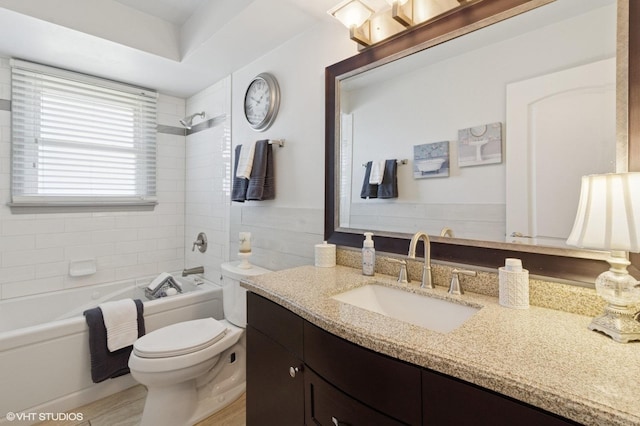 full bathroom featuring toilet, shower / washtub combination, and vanity