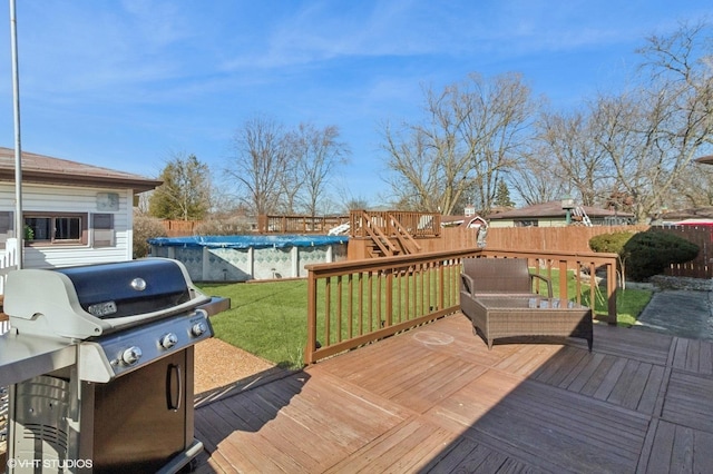 wooden deck featuring a fenced backyard, a playground, grilling area, a yard, and a fenced in pool