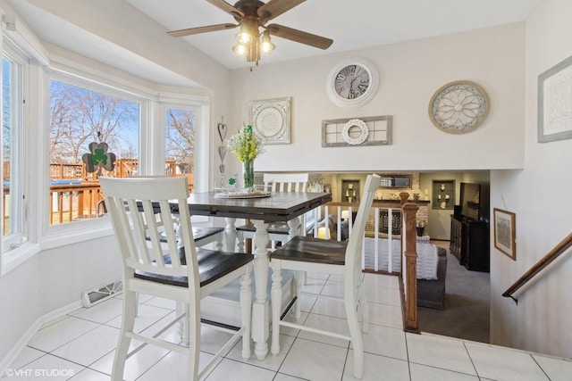 dining room featuring a ceiling fan, light tile patterned floors, baseboards, and visible vents