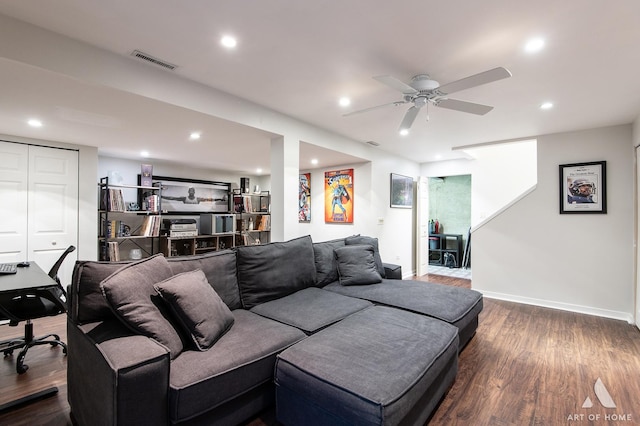 living room with baseboards, dark wood finished floors, visible vents, and recessed lighting